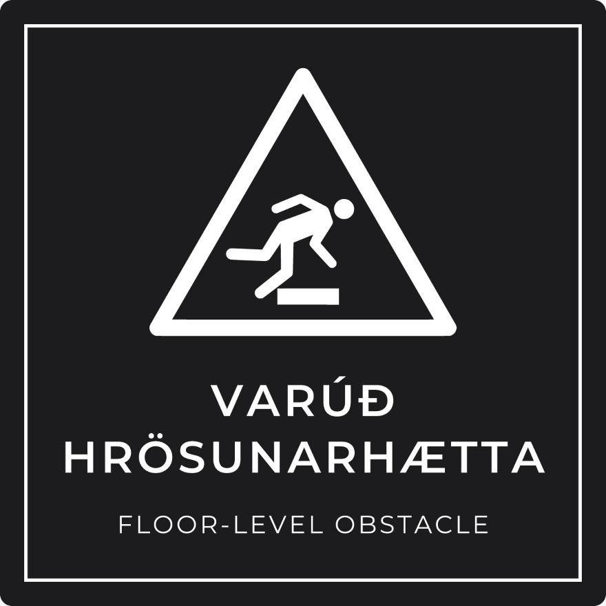 Varúð, hrösunarhætta - viðvörunarskilti, svart